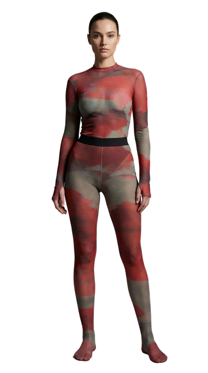 Full-length studio portrait showcasing the sheer Superior Agate Secondskin Burgundy MYCA Set with an abstract mineral print and integrated leggings.