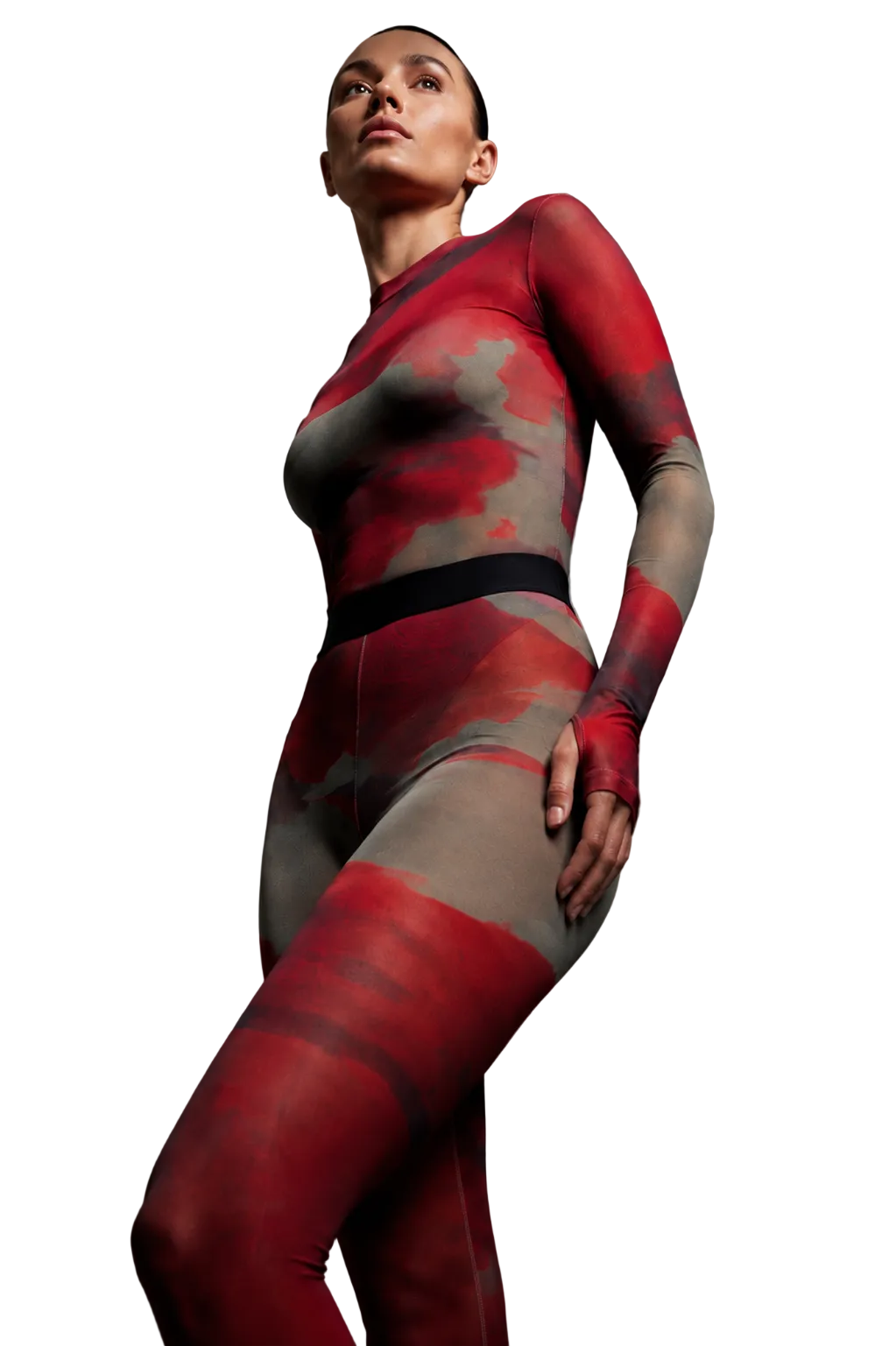  Low-angle studio shot of a model highlighting the mock-neck silhouette and liquid mineral energy print of the Superior Agate Secondskin mesh two-piece set.