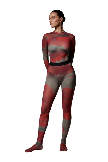 Full-length studio photo of a model wearing the Superior Agate Secondskin Burgundy MYCA Set, highlighting the sheer abstract print and full-coverage footed stocking finish.