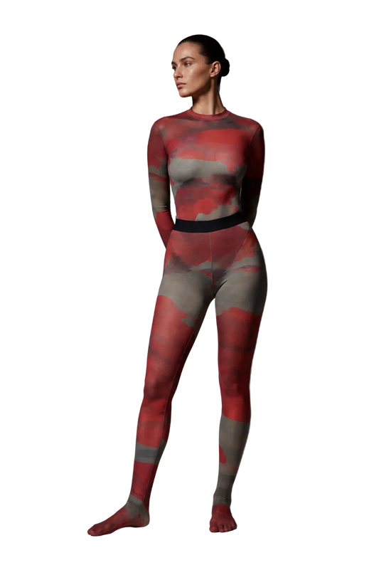 Full-length studio photo of a model wearing the Superior Agate Secondskin Burgundy MYCA Set, highlighting the sheer abstract print and full-coverage footed stocking finish.