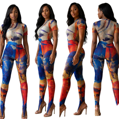 Four multi-angle views showing the front, side, and back of a model wearing The MYCA Canvas Body Series abstract print bodycon jumpsuit with a vibrant blue, orange, and red paint stroke design and stirrup leggings.