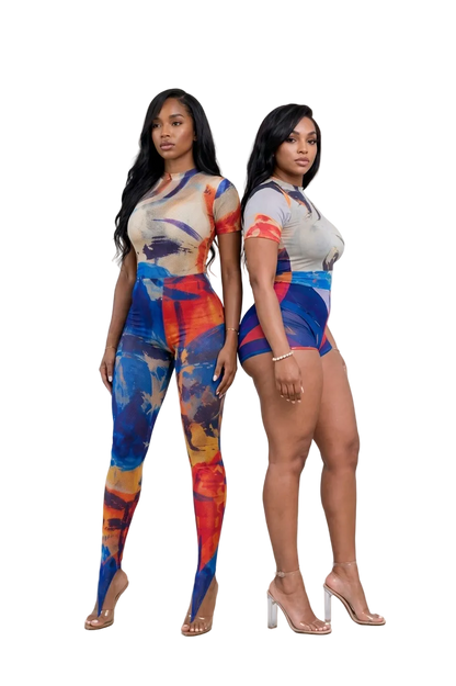 Two models standing back-to-back wearing The MYCA Canvas Body Series abstract print outfits; one in a full-length bodycon leggings jumpsuit and the other in a mesh bodysuit and mini shorts set with clear heels on a transparent grid background.